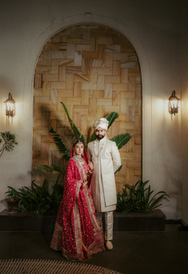 Sikh wedding couple portrait at venue entrance